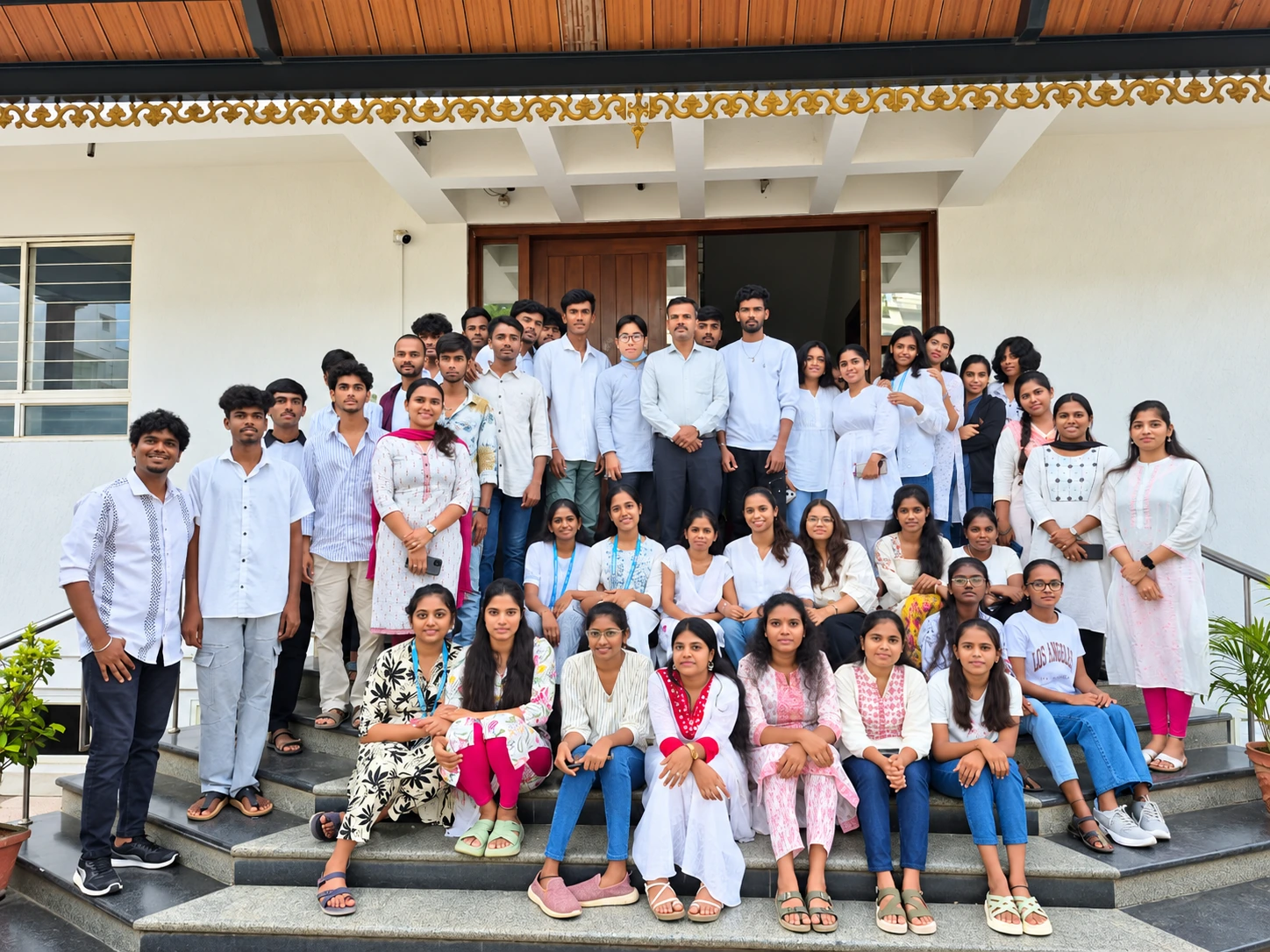 Students and faculty together outside the MVJ college building